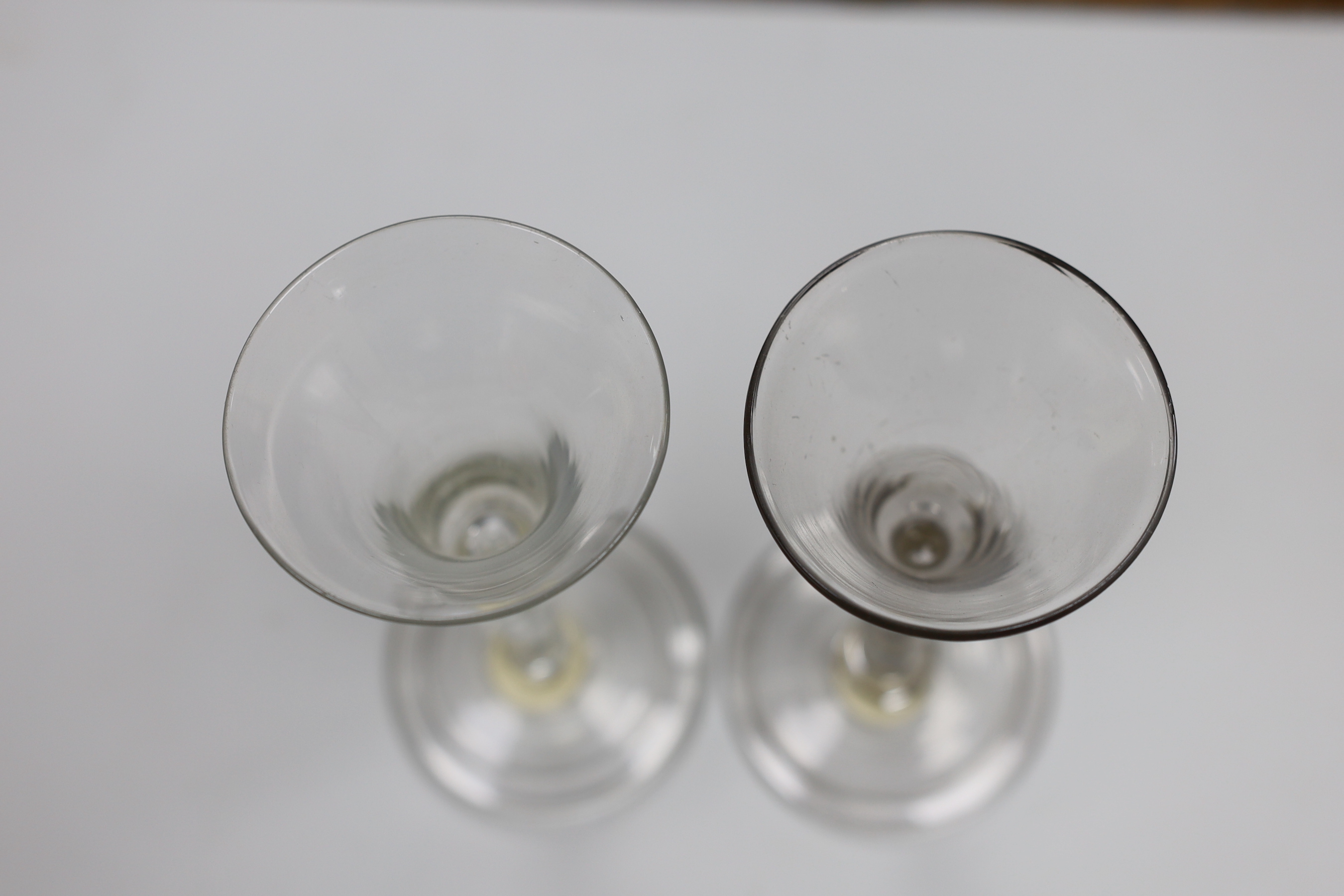 Two George II wine glasses, air tears and folded feet, tallest 16cm